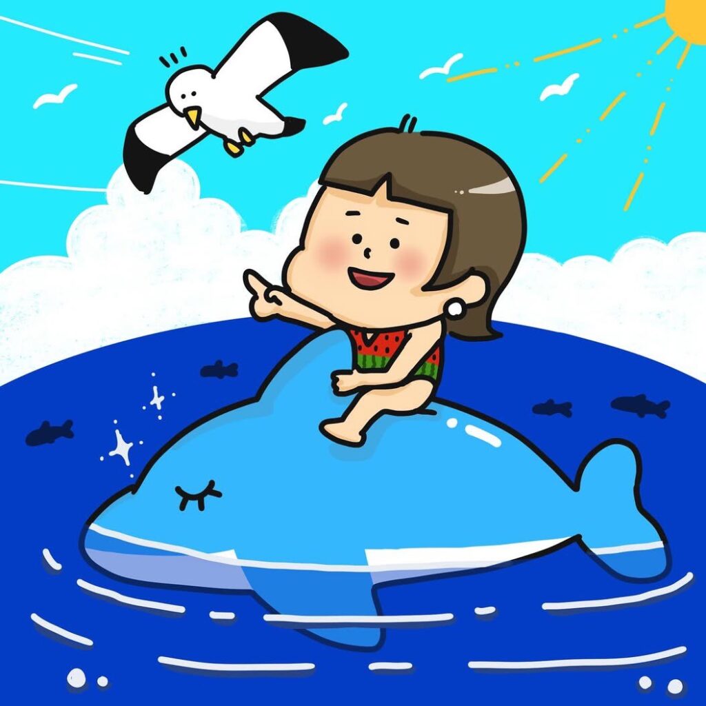 イルカの浮き輪に乗った女の子